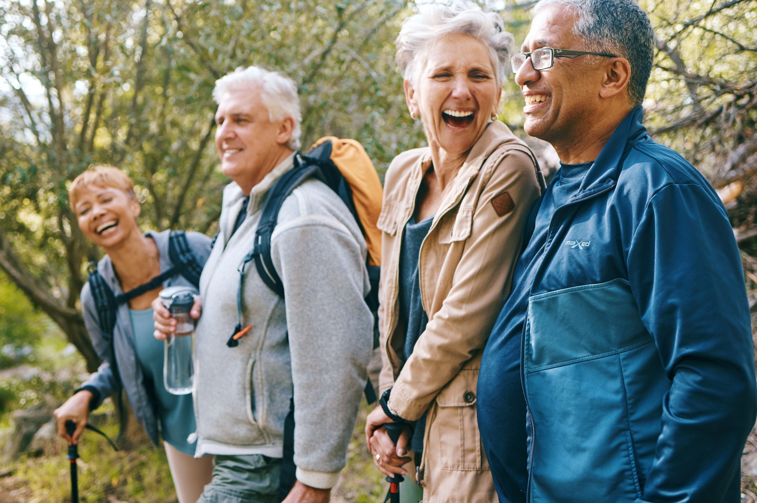 Group of happy people walking outside.